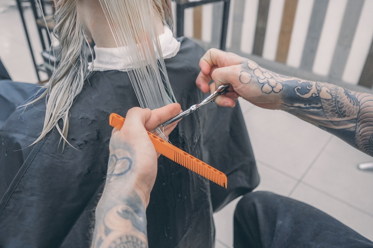 a person cutting hair